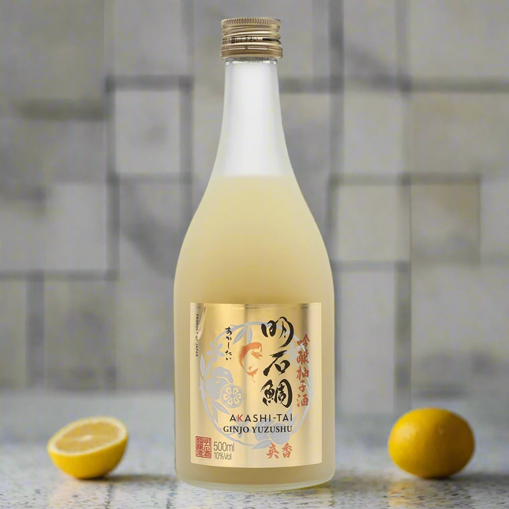 Akashi Tai Ginjo Yuzushu Sake on terrazzo counter with yuzu in a bright modern kitchen