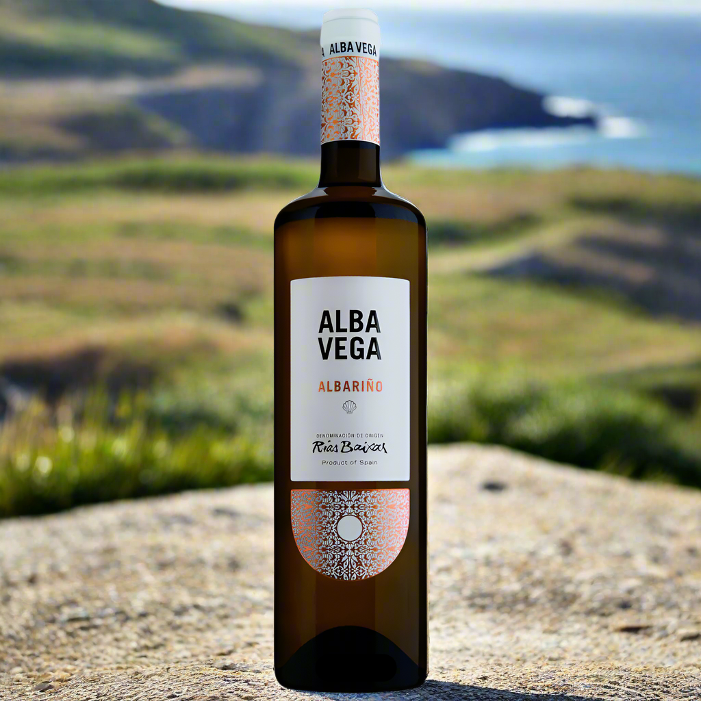 Alba Vega Albariño bottle on stone table overlooking the Galician coastline
