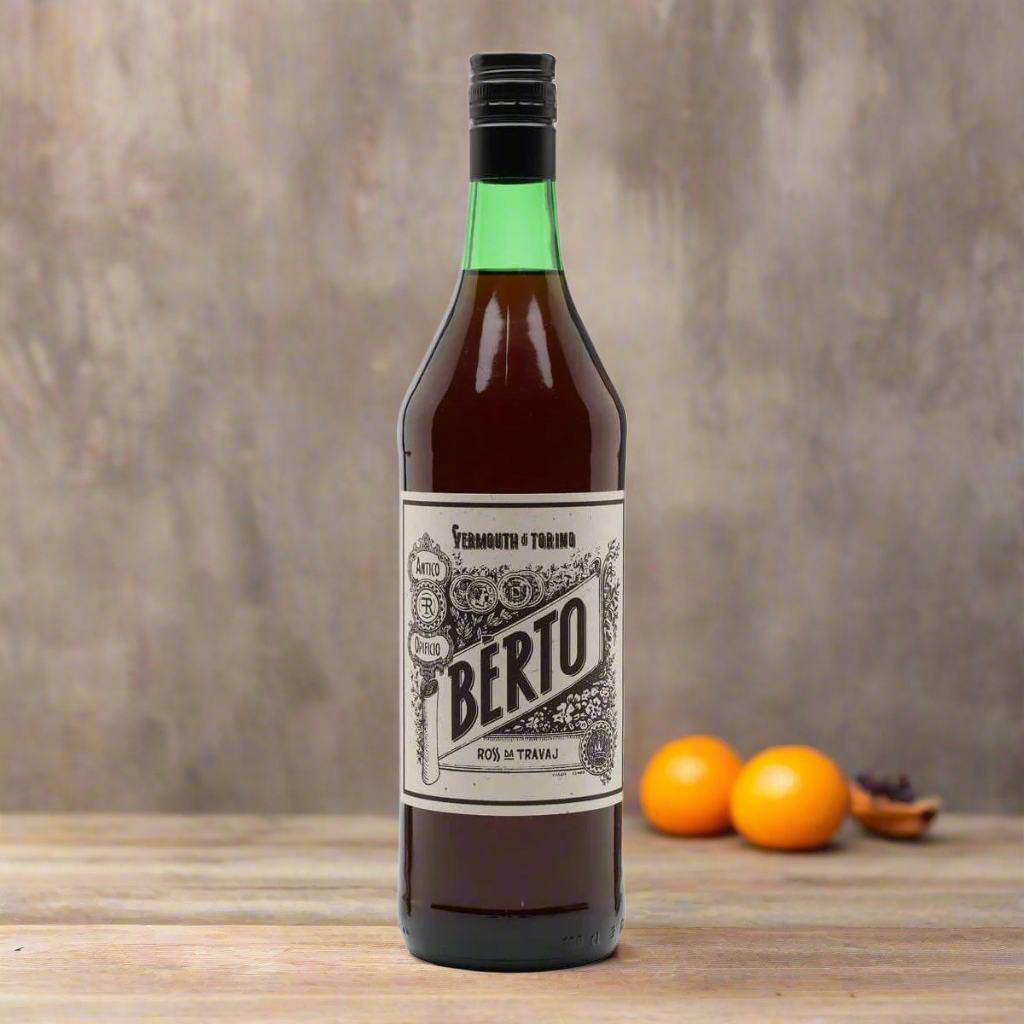 “A cosy Italian bar scene with a bottle of Bèrto Vermouth Rosso by Quaglia on a wooden table, alongside a cut-glass tumbler filled with vermouth on ice, garnished with orange peel. Warm ambient lighting, vintage décor, herbs and spice jars in the background.”