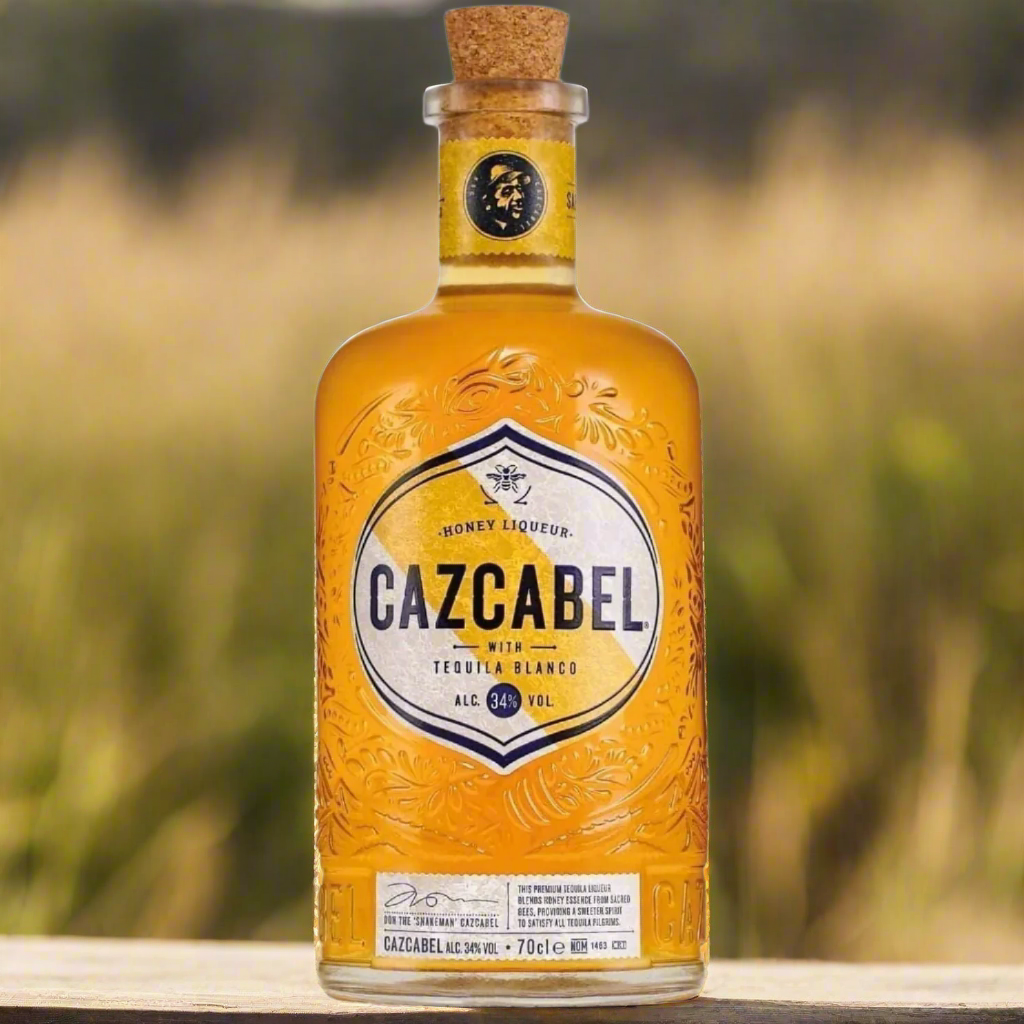 Bottle of Cazcabel honey liqueur with a blurred natural background