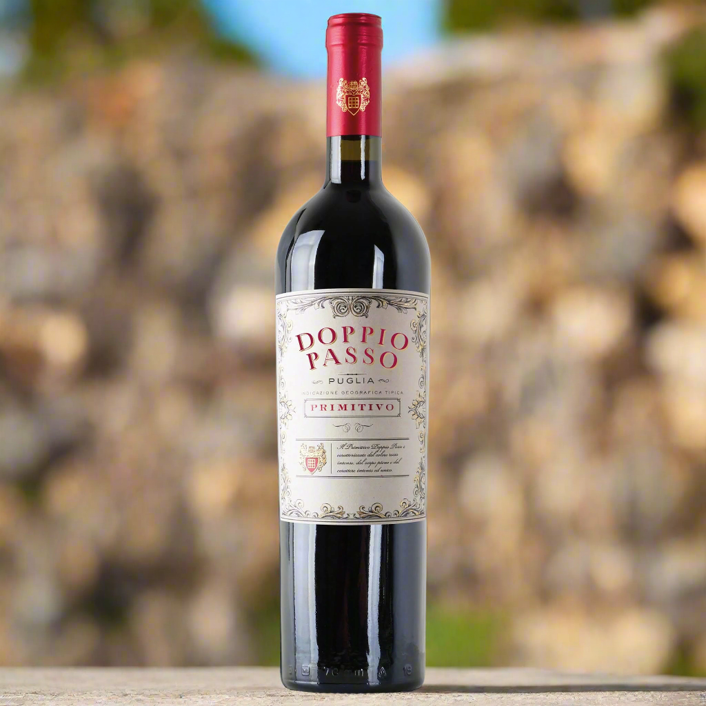 A bottle of Doppio Passo Primitivo IGT Puglia bottle on a stone wall with blurred natural background