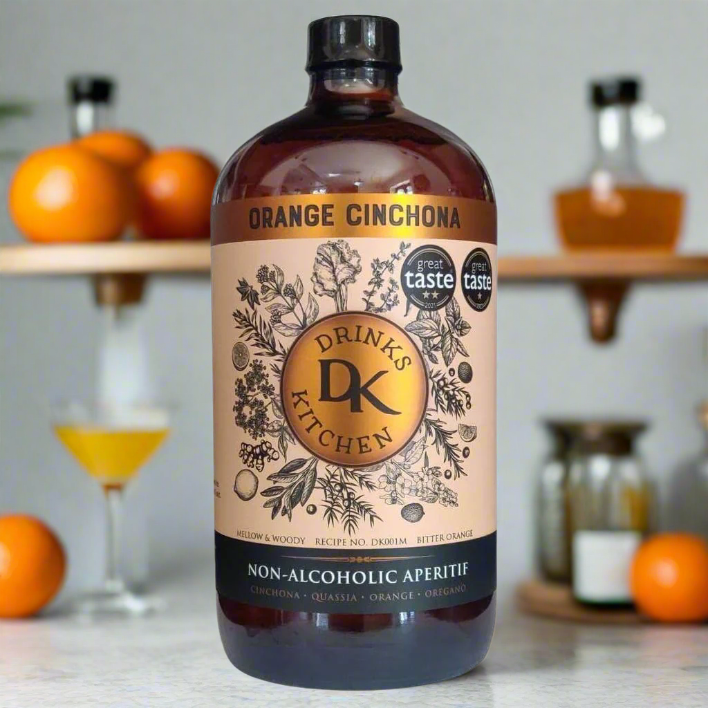 Artisanal Bar Cart with Citrus and Bitters Accents
A chic indoor bar cart with dried orange wheels, bottles of soda water and tonic, elegant glassware, and garnish bowls. The Orange Cinchona bottle stands front and centre, showcasing its bold label in a setting that highlights adult flavour and versatility in alcohol-free cocktails.