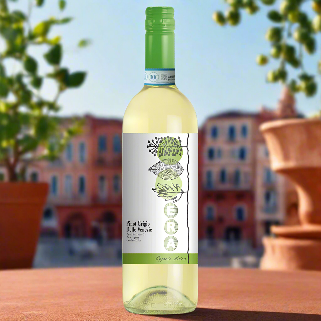 ERA Organic Pinot Grigio bottle on a sunny rooftop terrace with lemons and potted herbs.