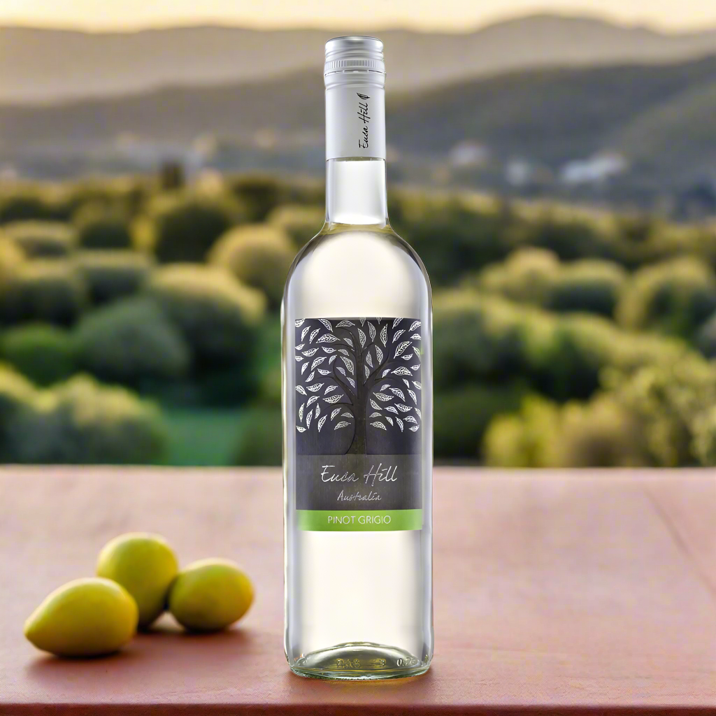 Euca Hill Pinot Grigio white wine bottle on a sunlit rooftop terrace with olives and lemon