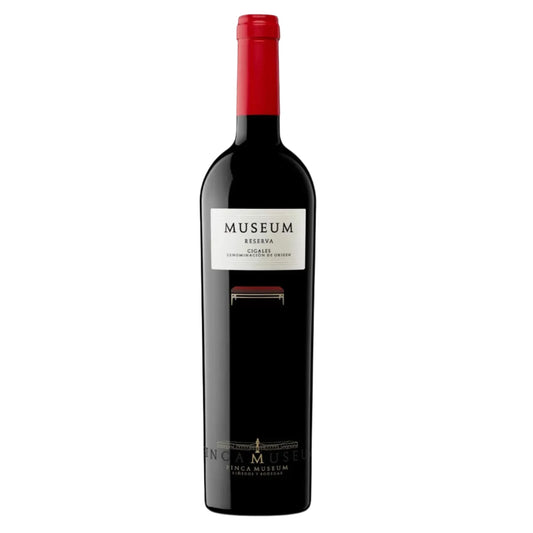 Red wine bottle with 'Museum Reserva' label on a white background