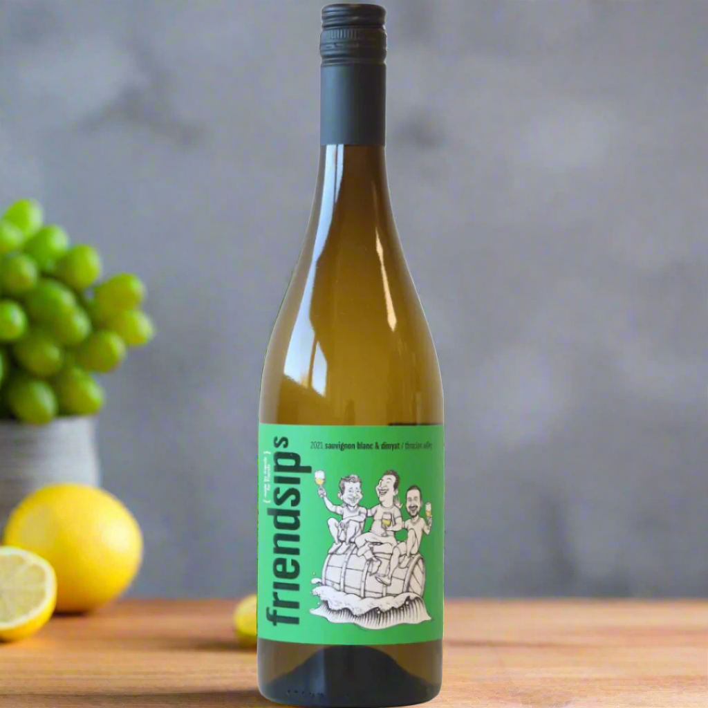 Friendsips Sauvignon Blanc bottle in modern kitchen with lemon, mint, and grapes