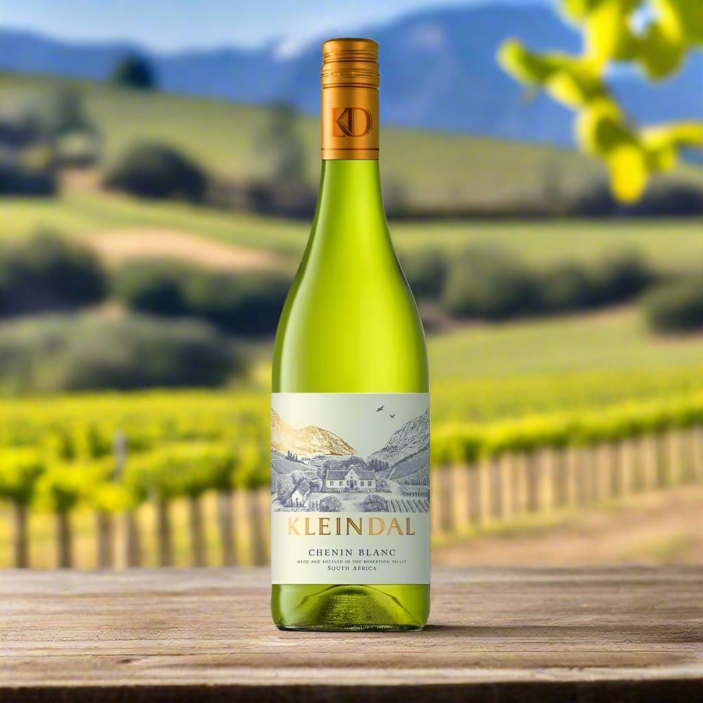 Place a bottle of Kleindal Chenin Blanc on a rustic table with golden vineyard rows and distant mountains under clear skies.