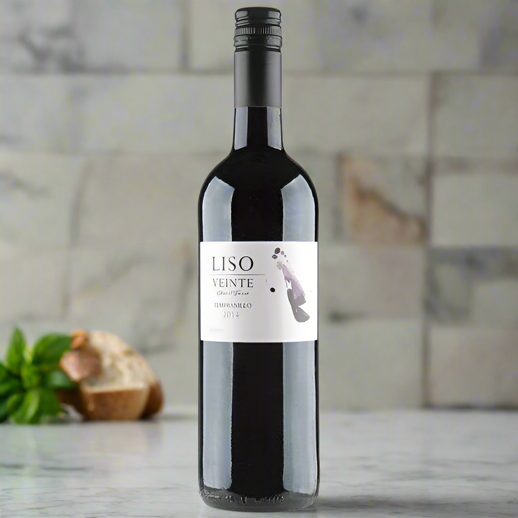Liso Veinte Tempranillo bottle on marble kitchen island with tomatoes and basil