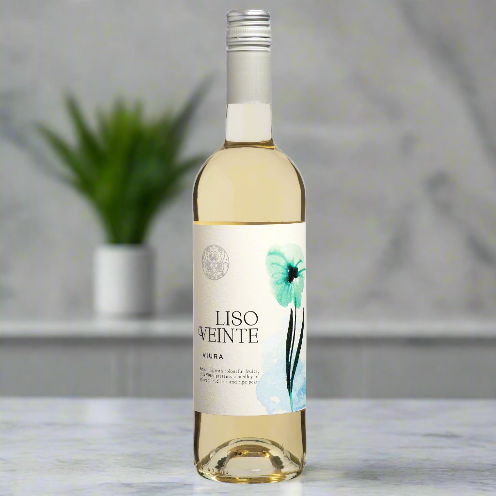 Liso Veinte Viura bottle on marble counter with citrus fruits and herbs