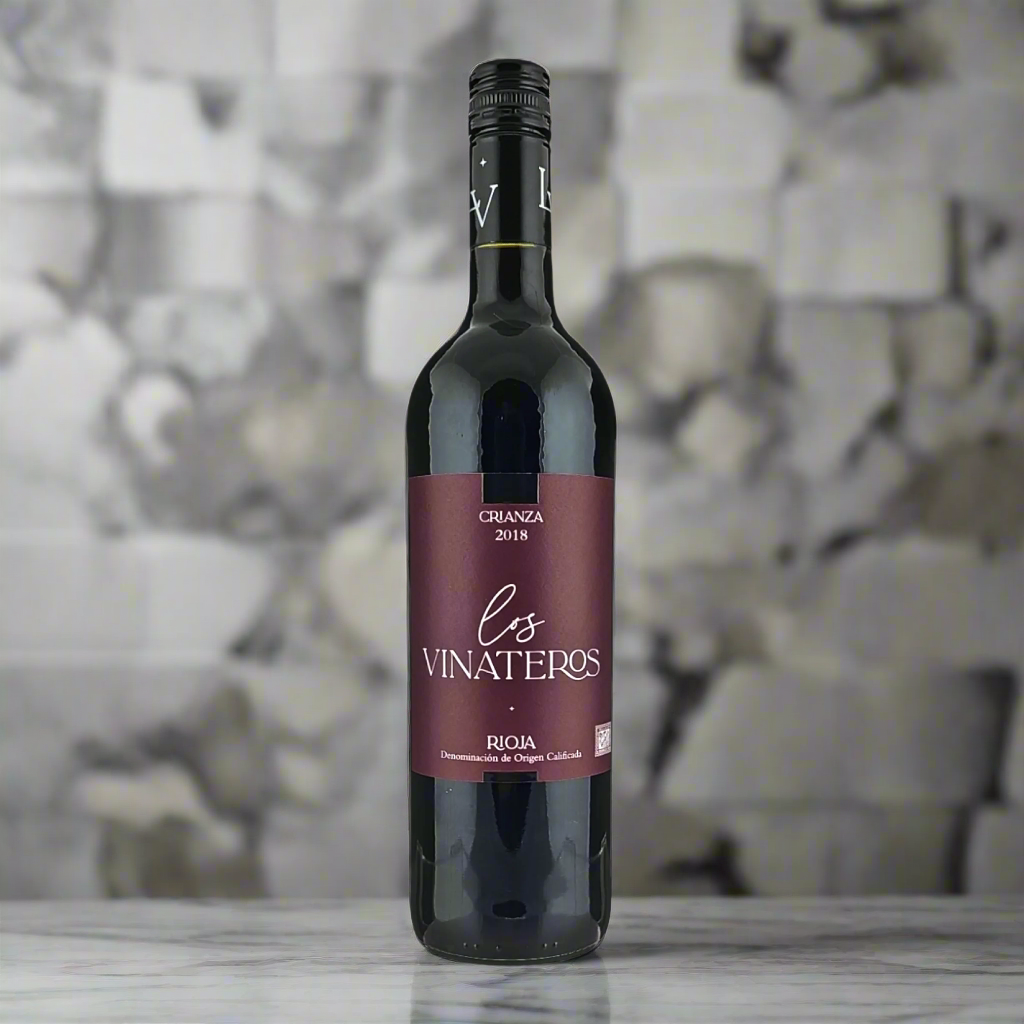 Los Vinateros Rioja Crianza bottle on marble counter in modern kitchen