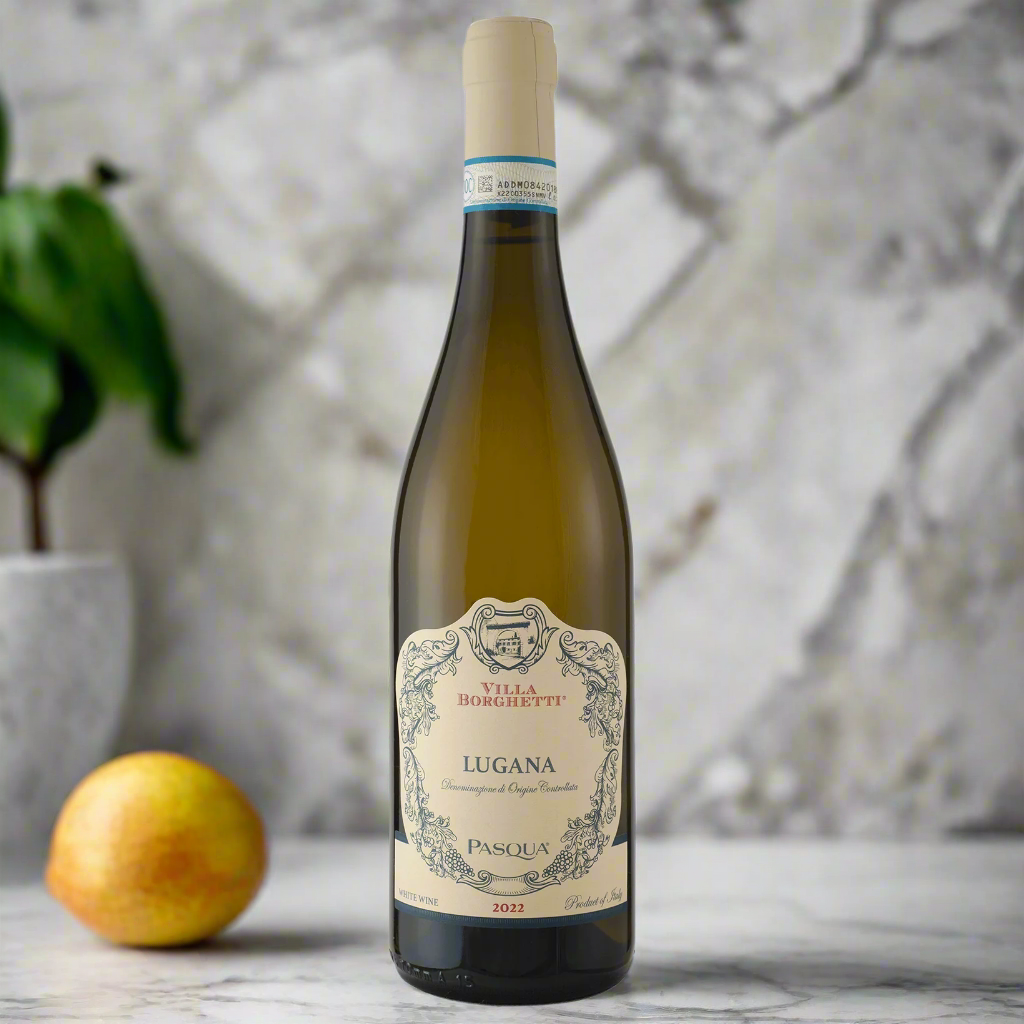Pasqua Villa Borghetti Lugana bottle on terrazzo counter with pear and basil