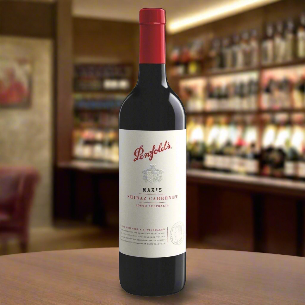Sophisticated Wine Tasting Room with Deep Tones
A refined, dimly lit room with rich wooden furniture, a few leather armchairs, and soft lighting creating an inviting, elegant atmosphere. The bottle of Penfolds Max's Shiraz Cabernet is prominently displayed next to a glass filled with the deep red wine, complemented by cheese and charcuterie plates, suggesting a rich tasting experience.