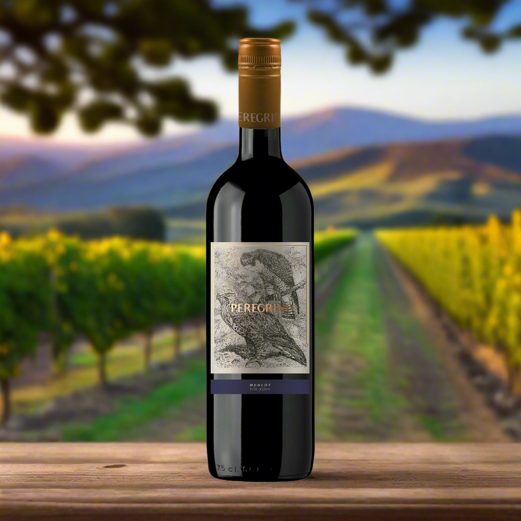 A peaceful Chilean vineyard at golden hour, rows of Merlot vines stretching into the distance under a warm, dusky sky. In the foreground, a rustic wooden table holds a bottle of red wine labelled "Peregrino Merlot" beside a filled glass, soft shadows playing across the scene. The mood is inviting, relaxed, and naturally beautiful.