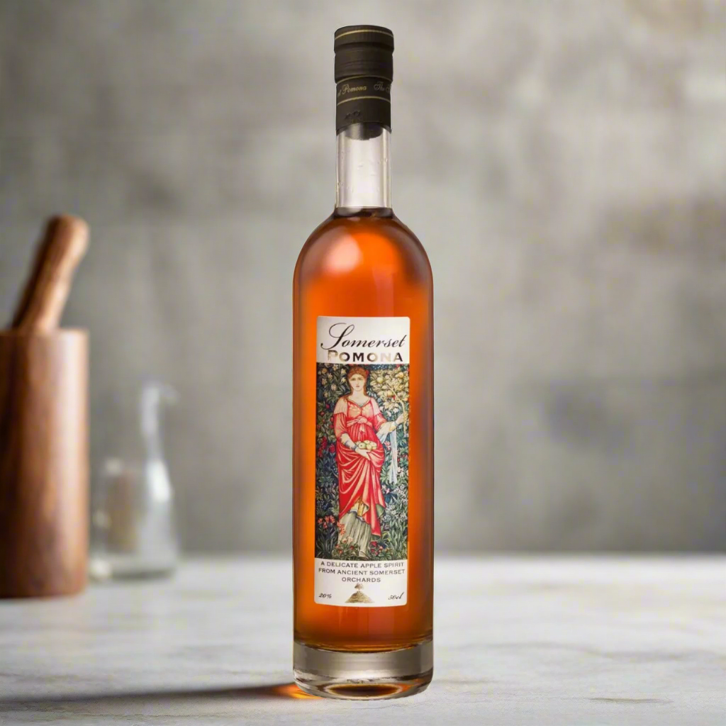 Somerset Cider Brandy Pomona bottle on stone surface in bright kitchen