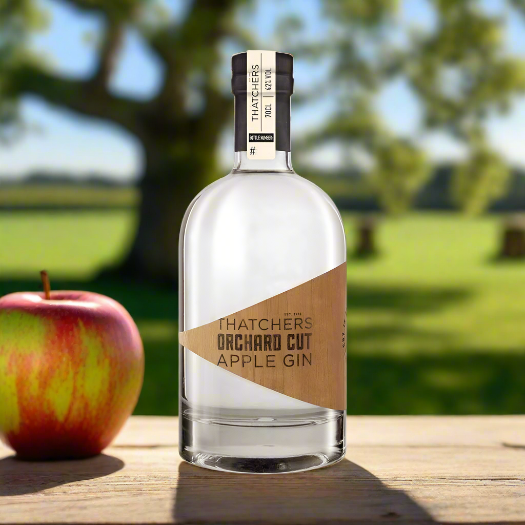 Sunlit Somerset Apple Orchard
Rows of apple trees in full bloom or fruit, with golden afternoon light streaming through the leaves. A rustic crate of apples sits nearby, and the bottle of gin is placed on a wooden table or barrelāevoking freshness and local provenance.