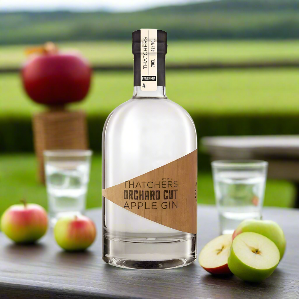 Crisp Garden Table Setting with Fresh Apples
A neatly set garden table with a G&T glass garnished with apple slices, surrounded by red and green apples in a basket. The bottle is centre stage with hints of English countryside in the backgroundāperfect for showcasing Thatchersā orchard-to-glass story.