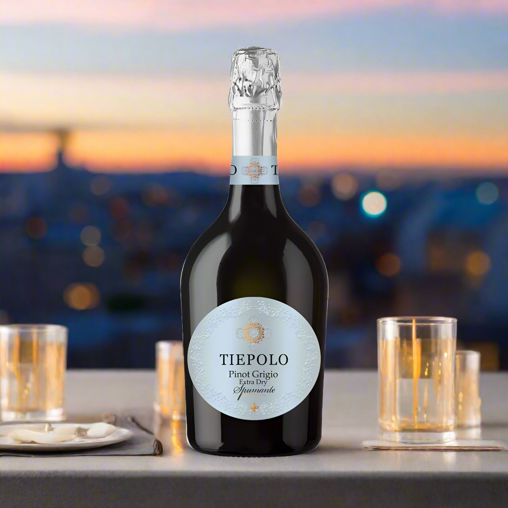 Tiepolo Sparkling Pinot Grigio on rooftop party table with sunset and skyline backdrop
