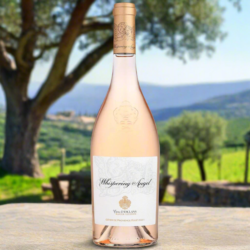 Sunlit Provençal vineyard with olive trees and lavender, a bottle of pale rosé on a stone table under a cypress tree, soft pastel sky and distant hills