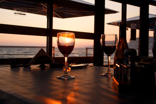 An intimate wine dinner setting with candlelight and wine glasses