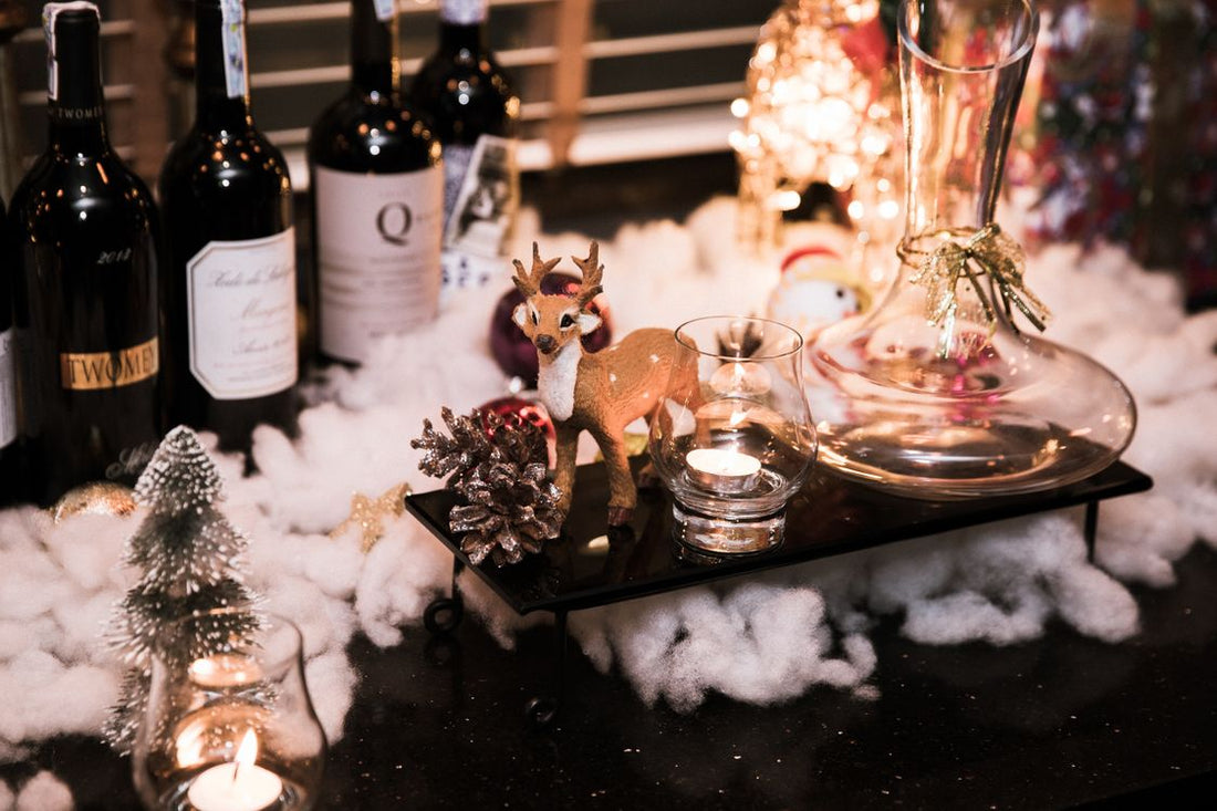 Wine bottles and Christmas decorations on a festive table