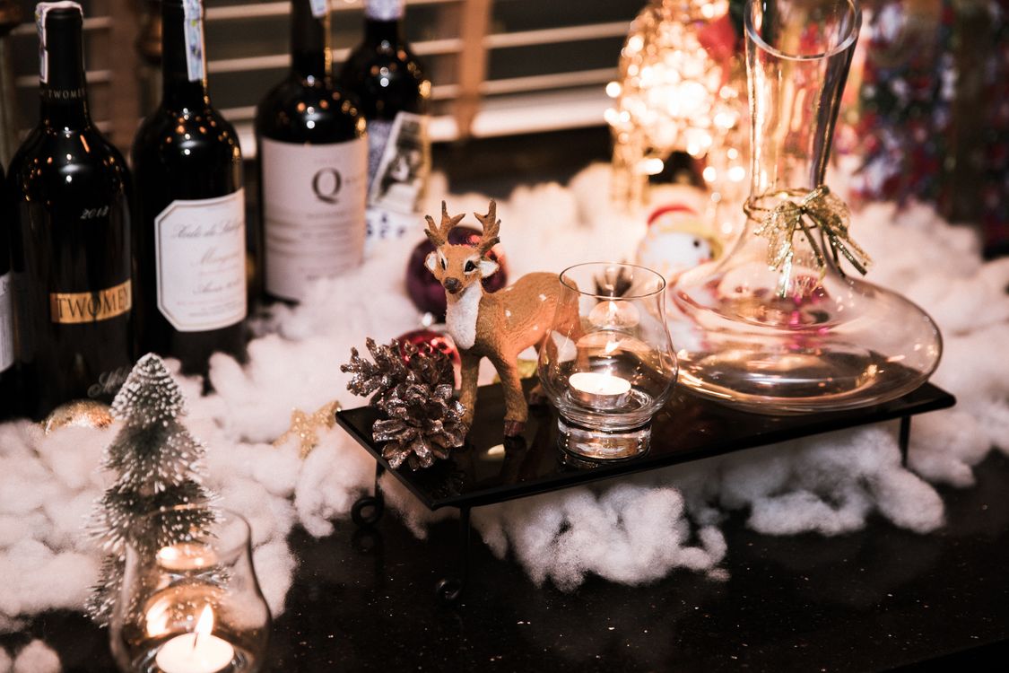 Wine bottles and Christmas decorations on a festive table