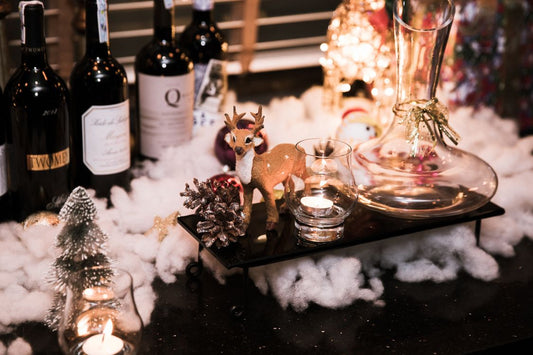 Wine bottles and Christmas decorations on a festive table