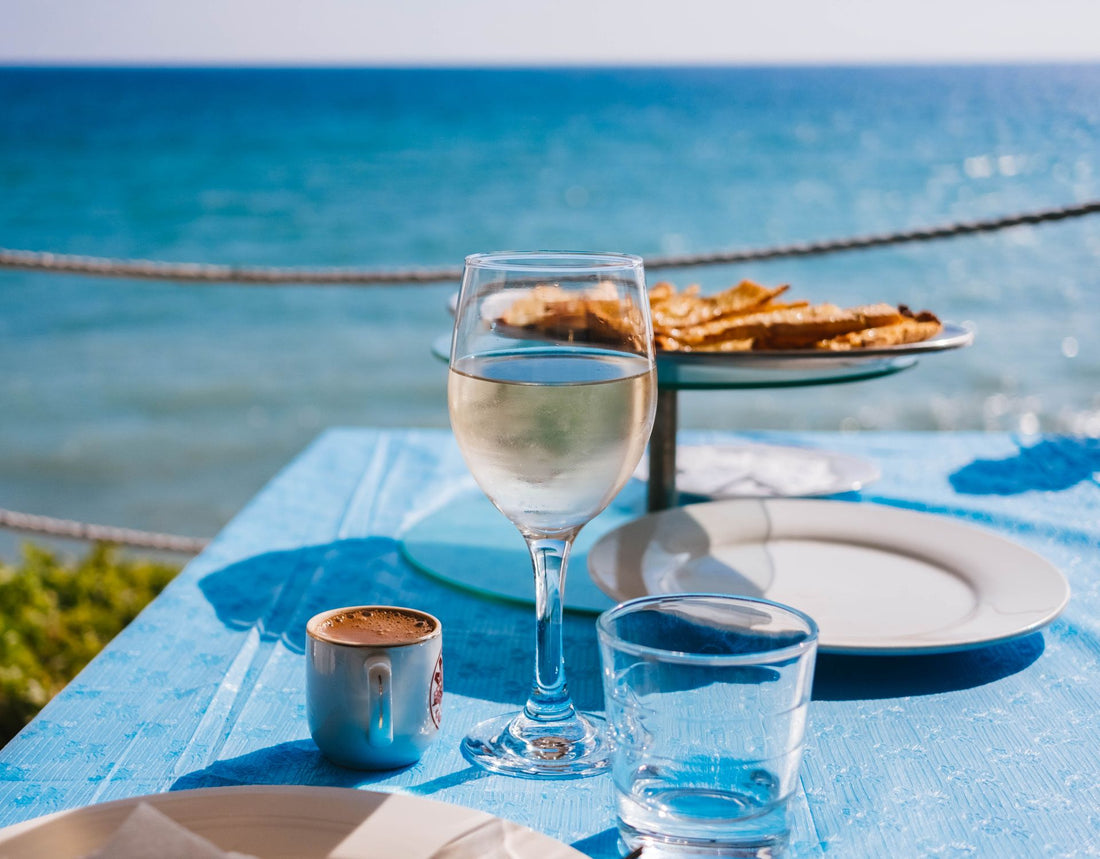 White wine glass at a sunny seaside terrace