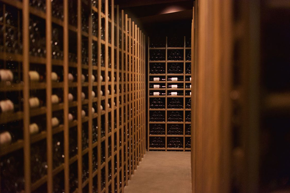 Rows of wine bottles in an elegant cellar in Pauillac, France