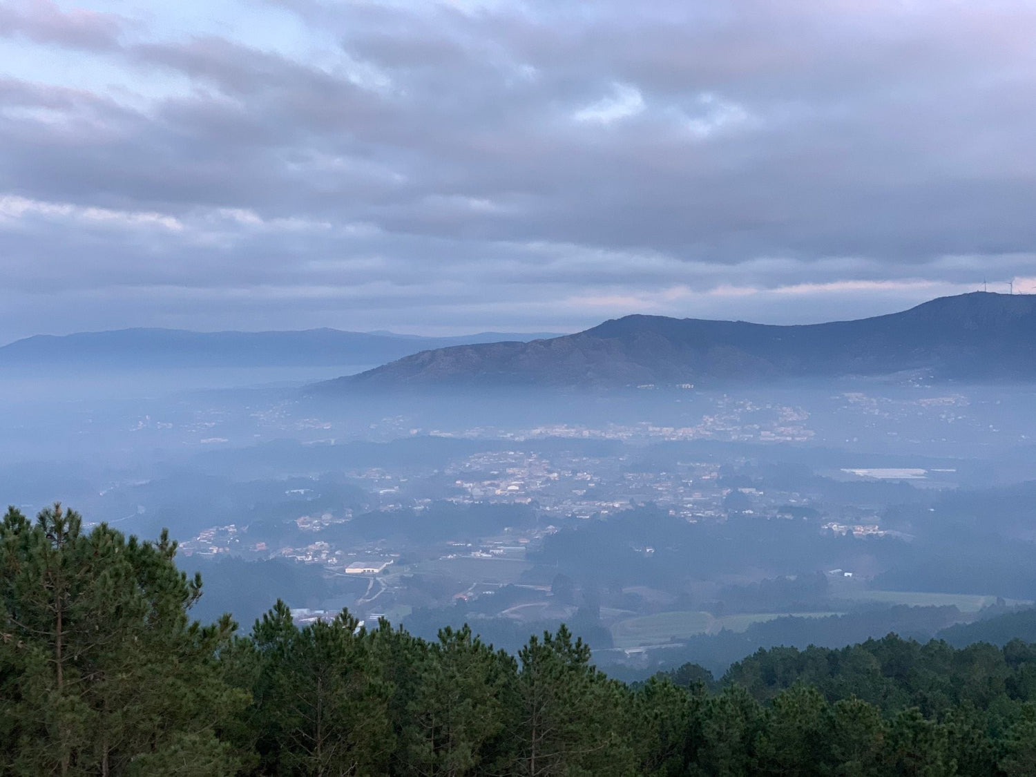 Mist rolling through a Portuguese mountain valley near Penalva do Castelo, Dão wine region
