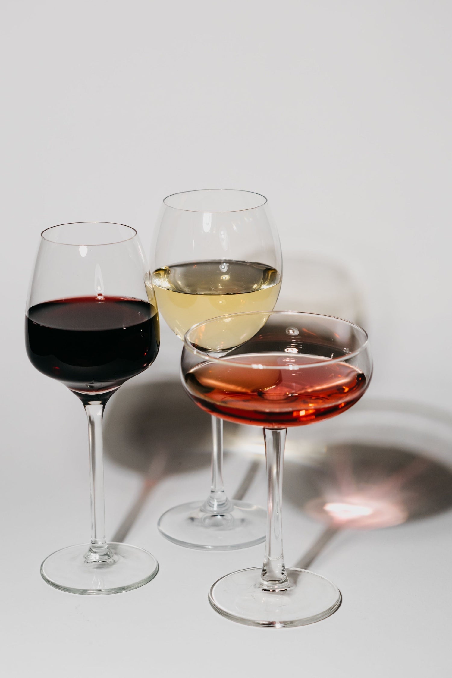 Red, white and rosé wine in different glass styles.