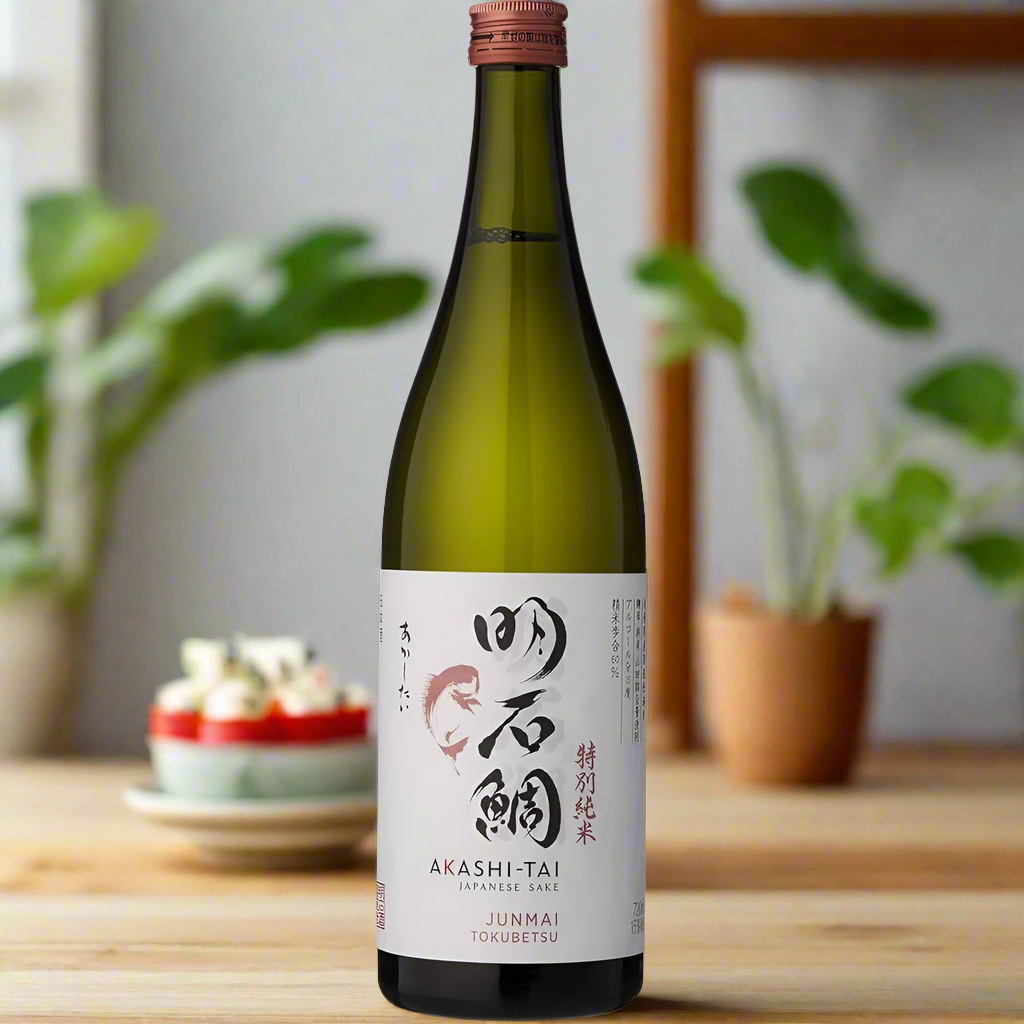 Akashi Tai Junmai Tokubetsu Sake bottle on modern kitchen island with sushi