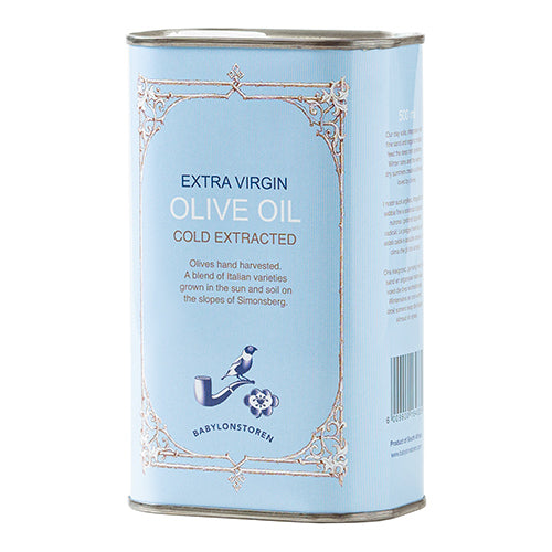Can of Babylonstoren cold extracted extra virgin olive oil with decorative blue label on a white background