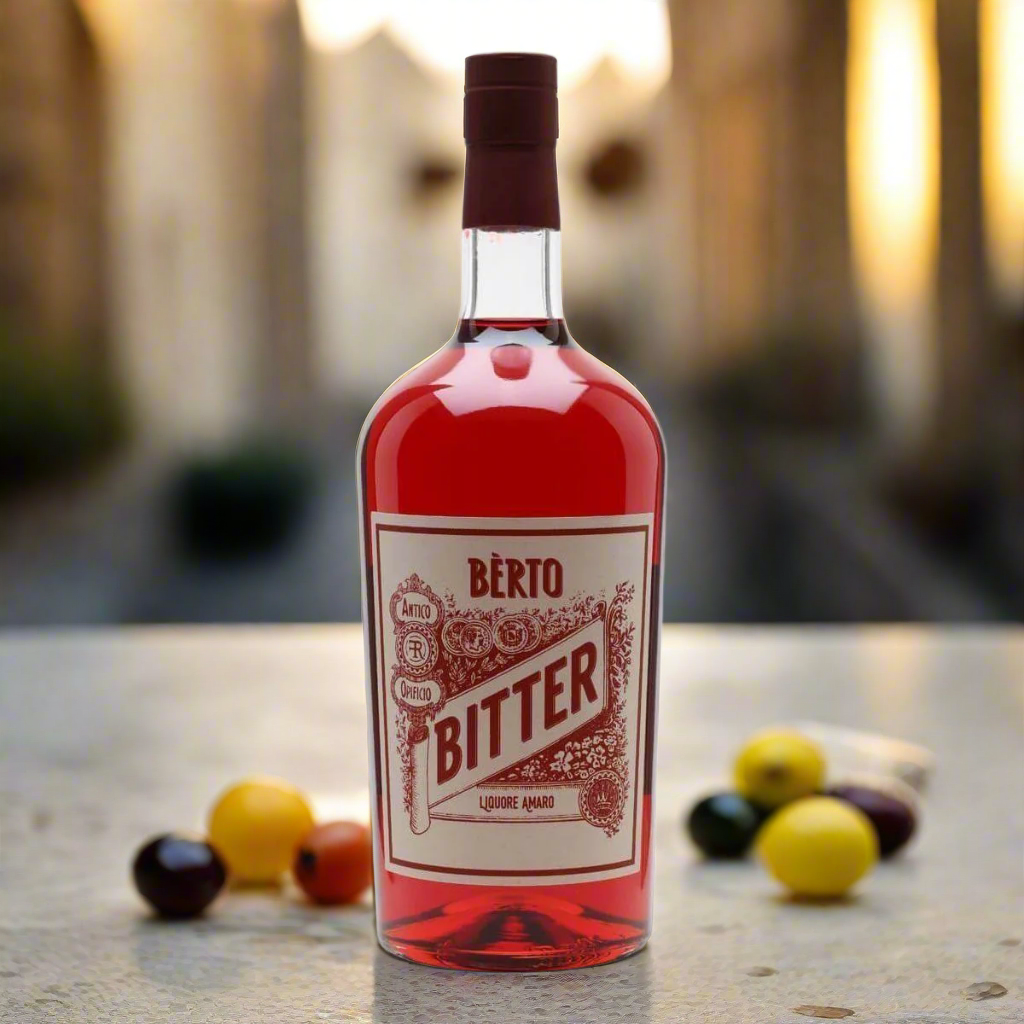 “A classic Italian apéritif setting with a bottle of Quaglia Bitter Bèrto on a terrazzo table, surrounded by olives, citrus slices, and a vintage glass with a Negroni. Warm golden light, old-town Italian backdrop, rustic charm.”