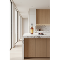 Blandy’s Bual 10 Year Old Madeira wine bottle displayed on a marble kitchen island in a bright contemporary home with an elegant dessert setting.