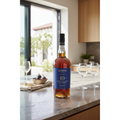 Blandy’s Verdelho 10 Year Old Madeira wine bottle displayed on a polished stone kitchen island in a bright contemporary coastal-inspired home.