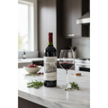 Chateau Montelena Cabernet Sauvignon displayed on a modern kitchen island beside a decanter and wine glass in natural daylight.