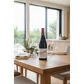 Châteauneuf-du-Pape Télégramme wine bottle displayed on an oak dining table in a bright contemporary kitchen and dining space.