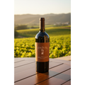 Clos du Val Cabernet Sauvignon bottle displayed on a vineyard terrace overlooking Napa Valley vineyards at sunset.