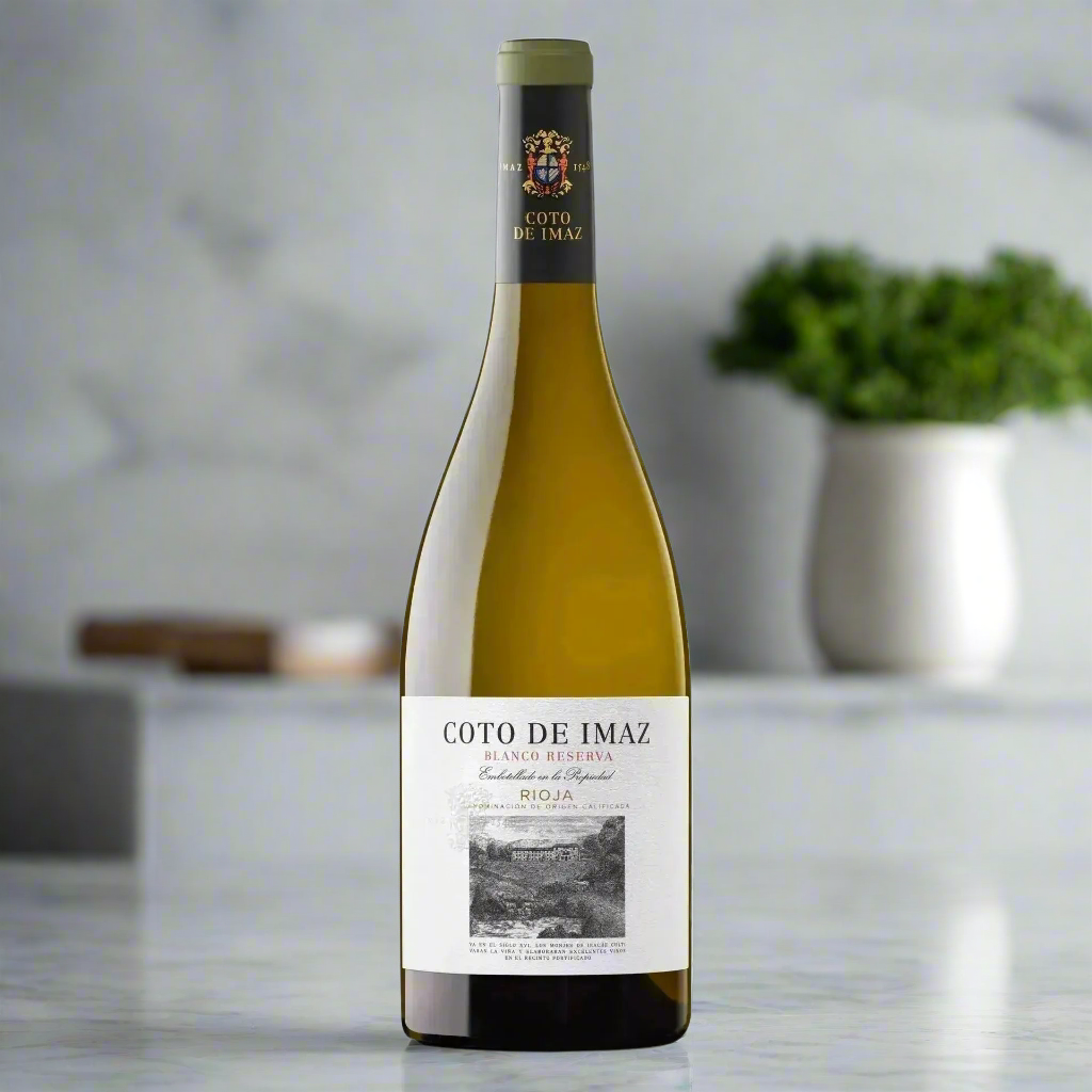 Coto de Imaz Blanco Reserva on marble counter with herbs in a modern kitchen
