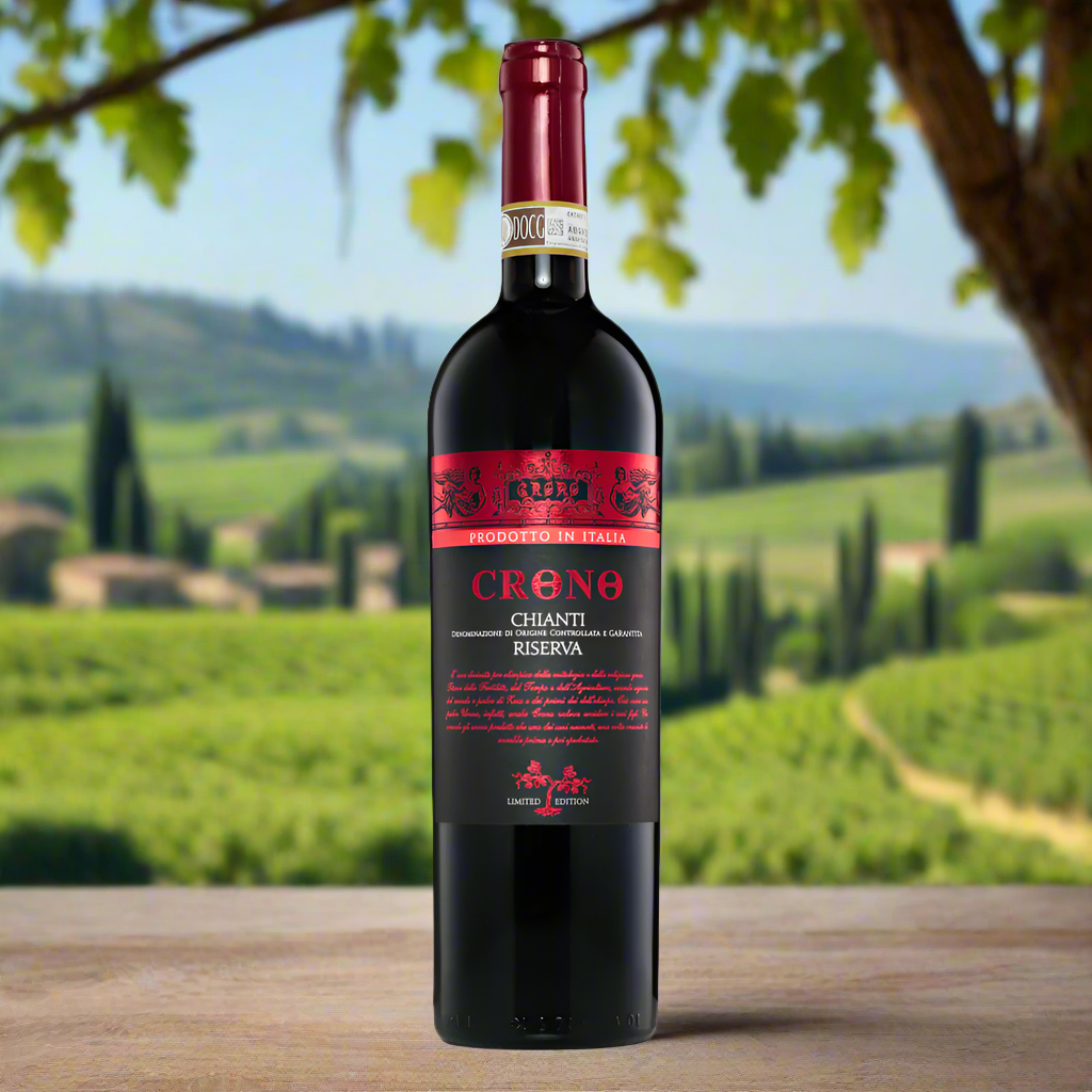 Chianti bottle on Tuscan terrace with vineyard and olive branches in background