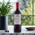 Finca Clasica Malbec & Shiraz bottle on marble counter with herbs and olives