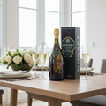 Gosset Grand Millesime Brut 2016 Champagne with Gift Box displayed on a modern dining table with champagne flutes and natural daylight.