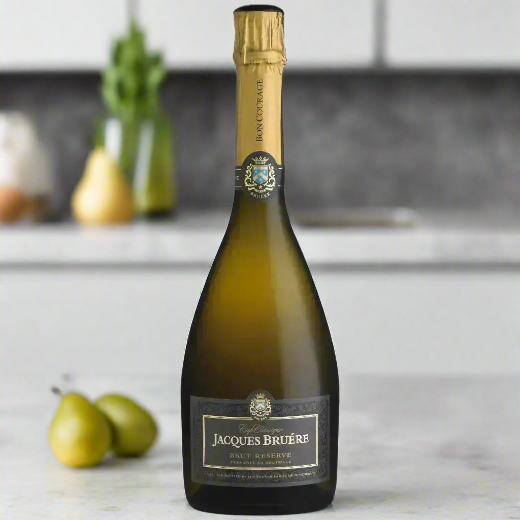 Jacques Bruere Cap Classique Brut with pear and lemon in modern kitchen