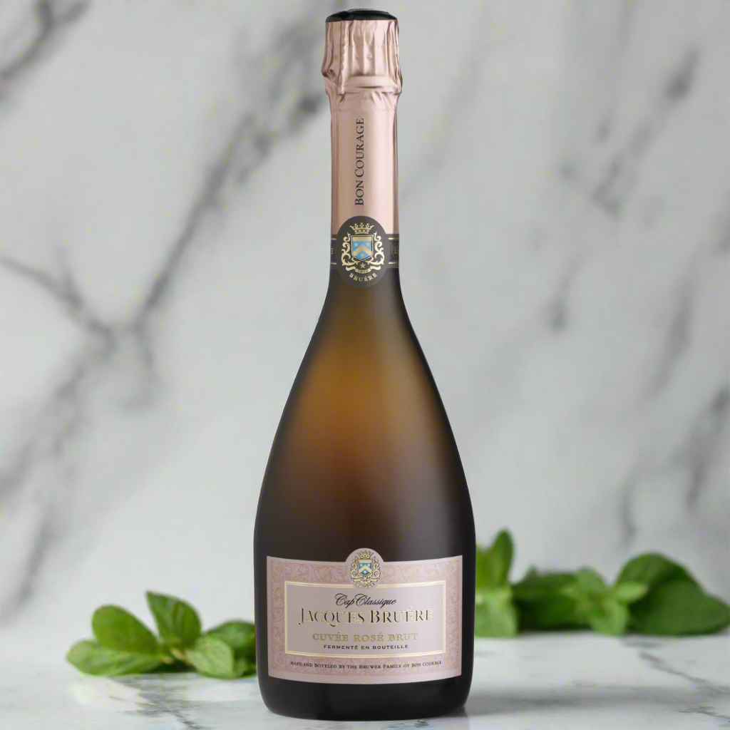 Jacques Bruere Cap Classique Cuvée Rosé with grapefruit and mint in modern kitchen