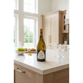 Joseph Mellot Sancerre La Grande Chatelaine wine bottle displayed on a light stone kitchen island in a bright contemporary home.
