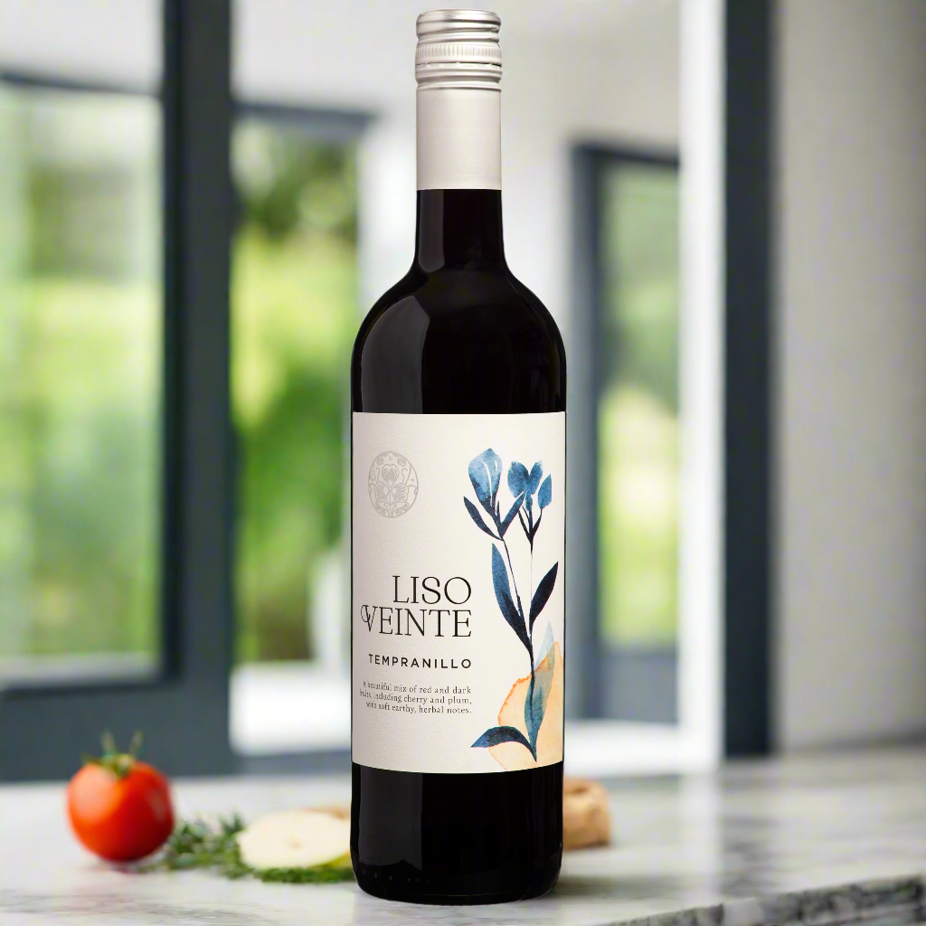 Liso Veinte Tempranillo bottle on marble counter with herbs and tomatoes in modern kitchen