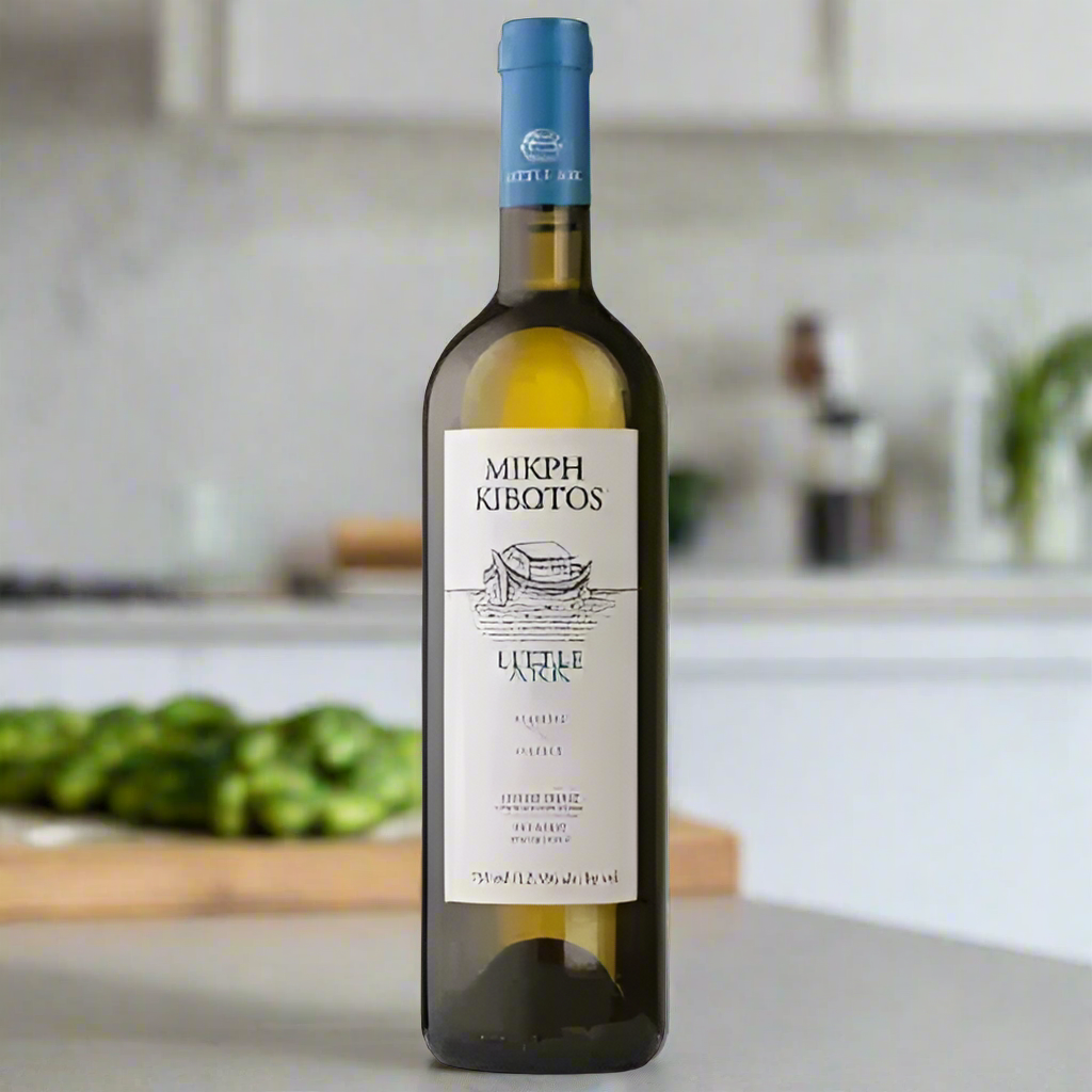 Little Ark Malagousia & Assyrtiko White wine bottle in modern kitchen with cucumber, mint, and olives on counter