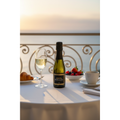 One4One Prosecco 200ml mini bottle displayed on a luxury hotel balcony breakfast table overlooking the sea.