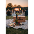 One4One Prosecco 200ml mini bottle displayed on a summer picnic blanket at an outdoor concert with picnic food and sparkling wine glasses.