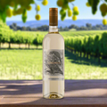 Peregrino Sauvignon Blanc bottle on rustic table with vineyard backdrop.